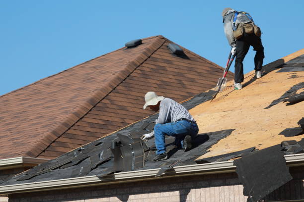 contractor roofing a home in St George